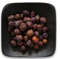 Organic hawthorn berries in black bowl
