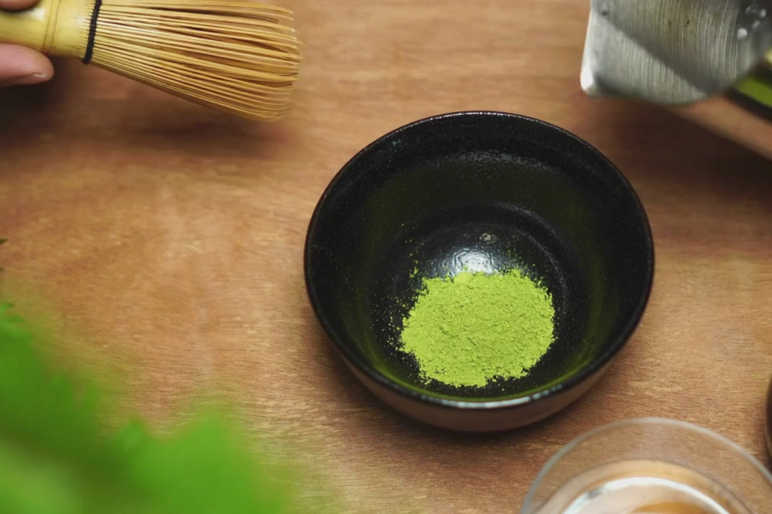 video of matcha powder being whisked with water